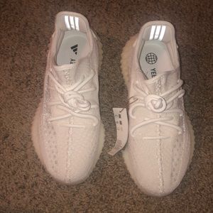 Brand new Yeezy sneakers come with original box tags attached